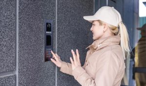 Guest Using Video Doorbell Entry System Video Doorbell
